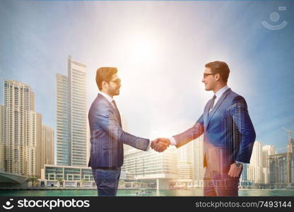 Businessman shaking their hands in agreement. Businessman shaking hands in agreement