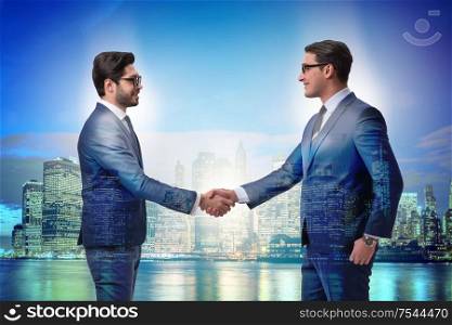 Businessman shaking their hands in agreement. Businessman shaking hands in agreement