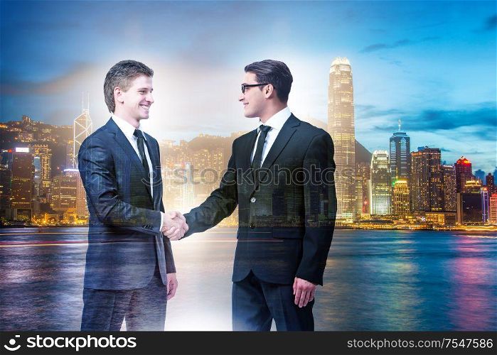 Businessman shaking their hands in agreement. Businessman shaking hands in agreement