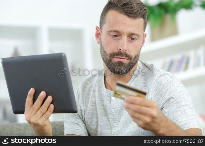 businessman shopping online at desk in office