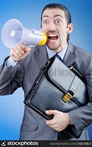 Businessman shouting via loudspeaker