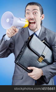 Businessman shouting via loudspeaker