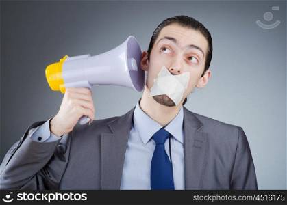 Businessman shouting via loudspeaker