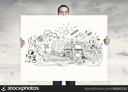 Businessman show banner. Businessman holding banner with business plan and strategy sketches