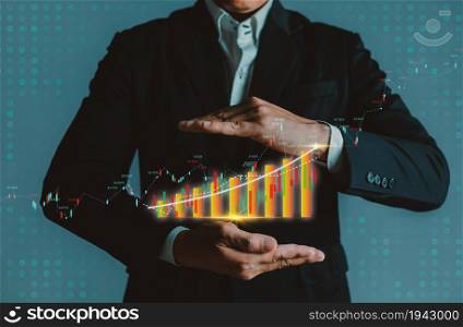 Businessman showing a growing corporate income statistics graph.