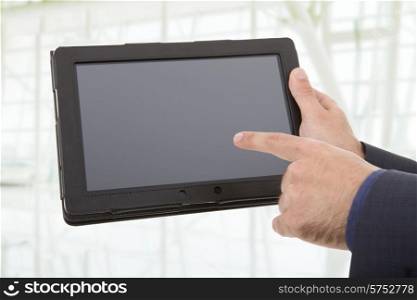 businessman showing a tablet pc, at the office