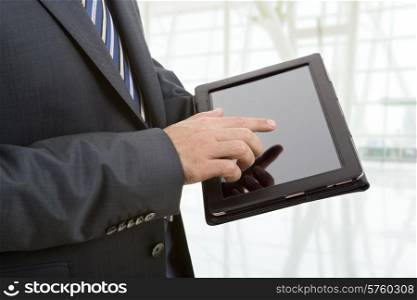 businessman showing a tablet pc, at the office
