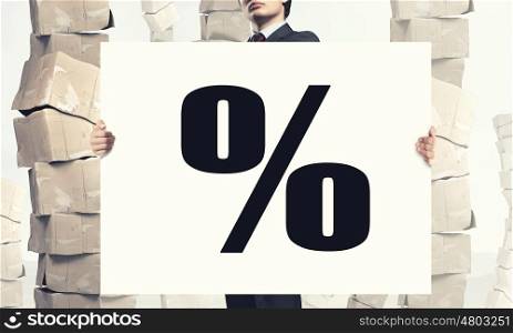 Businessman showing banner. Businessman showing white banner with percent symbol