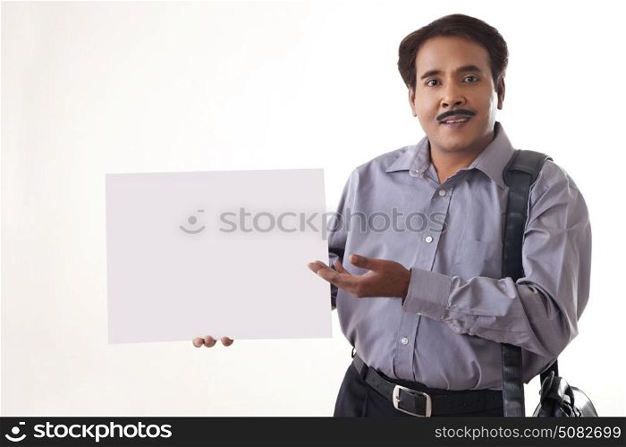 Businessman showing blank sign on white background