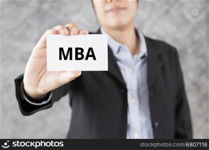businessman showing business card with word MBA