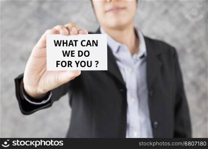 businessman showing business card with word what can we do for you