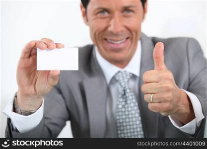 businessman showing card