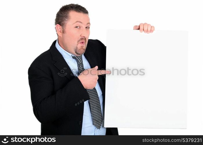 Businessman showing panel for message