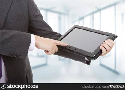 businessman showing touch pad, close up shot on tablet pc, at the office