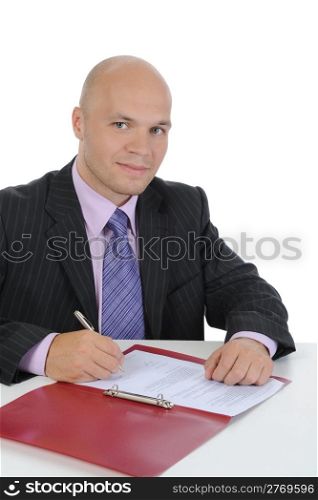 Businessman signs a contract. Isolated on white