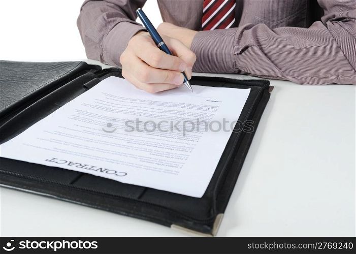 Businessman signs a contract. Isolated on white background
