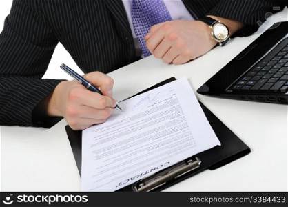 Businessman signs a contract. Isolated on white background