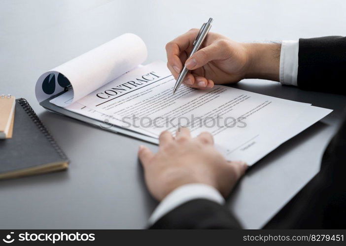 Businessman signs contract agreement paper or business legal form with trust and professionalism. Closeup of hand holding pen in corporate meeting for official business deal. Equilibrium. Closeup hand of businessman singing contract agreement paper. Equilibrium