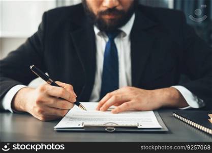 Businessman signs contract agreement paper or business legal form with trust and professionalism. Closeup of hand holding pen in corporate meeting for official business deal. Equilibrium. Closeup hand of businessman singing contract agreement paper. Equilibrium