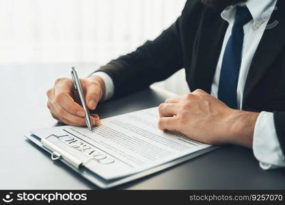 Businessman signs contract agreement paper or business legal form with trust and professionalism. Closeup of hand holding pen in corporate meeting for official business deal. Equilibrium. Closeup hand of businessman singing contract agreement paper. Equilibrium