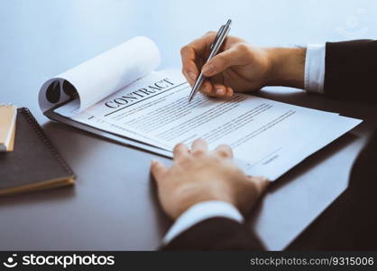 Businessman signs contract agreement paper or business legal form with trust and professionalism. Closeup of hand holding pen in corporate meeting for official business deal. Equilibrium. Closeup hand of businessman singing contract agreement paper. Equilibrium