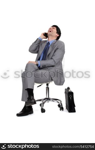 Businessman sitting and laughing
