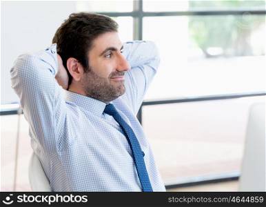 Businessman sitting and relaxing in office