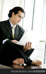 Businessman sitting and using a laptop