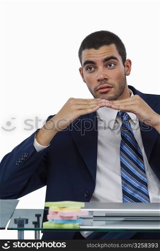 Businessman sitting at a desk and gesturing
