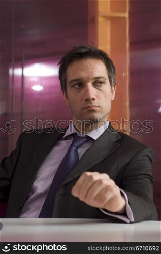 Businessman sitting at a table in an office