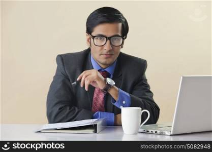 Businessman sitting at computer desk