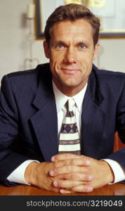 Businessman Sitting at Desk