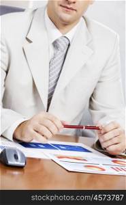 Businessman sitting at table and working in the office. Businessman at working desk