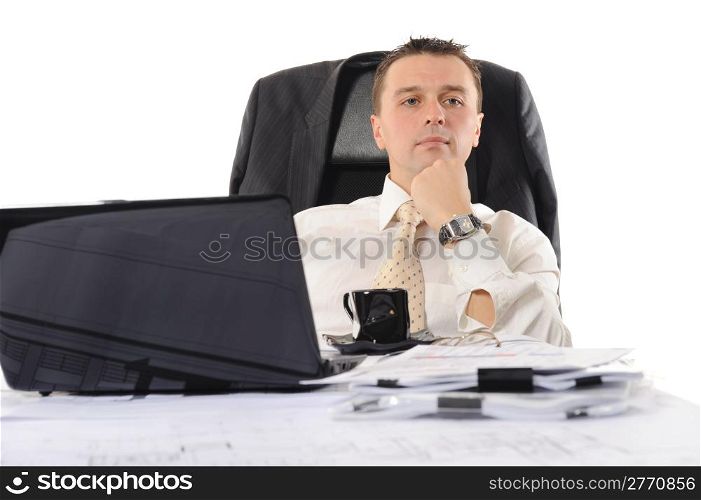 Businessman sitting before a computer. Isolated on white background