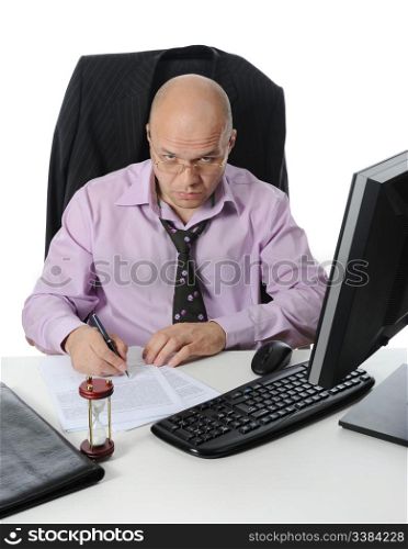Businessman sitting before a computer. Isolated on white background
