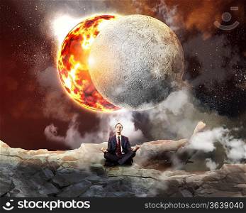 Businessman sitting in lotus flower position against space background