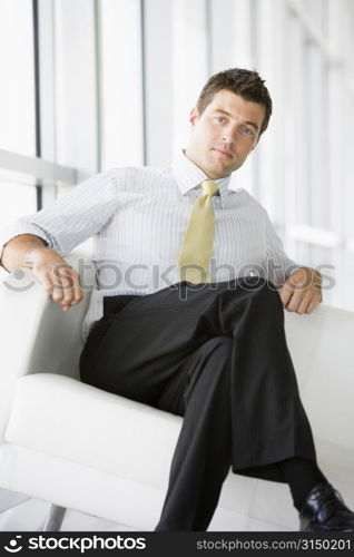 Businessman sitting in office lobby