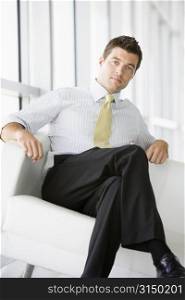 Businessman sitting in office lobby