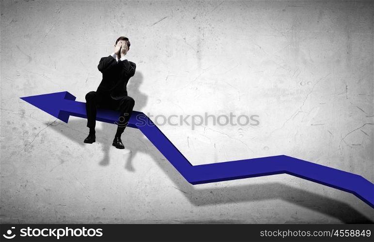 Businessman sitting on graph. Young businessman sitting on arrow with closed eyes