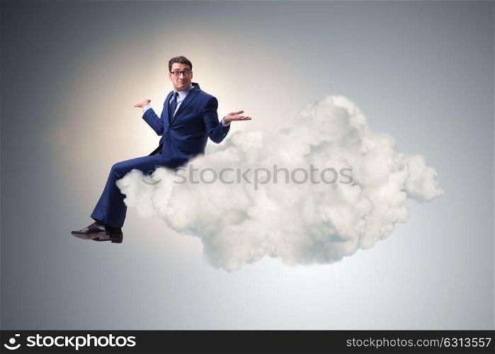 Businessman sitting on the cloud in motivitation concept