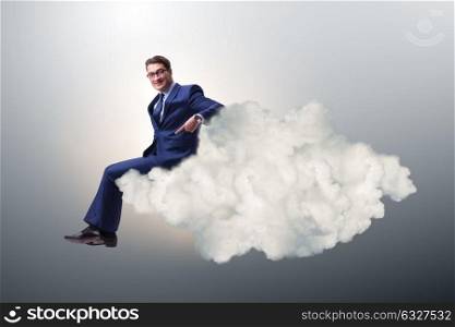 Businessman sitting on the cloud in motivitation concept