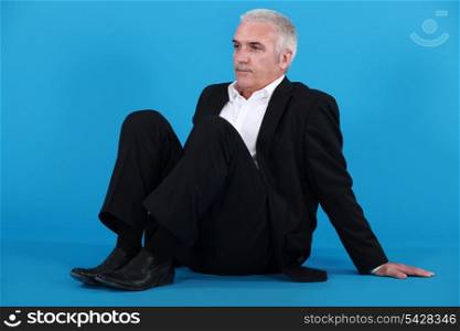 Businessman sitting on the floor