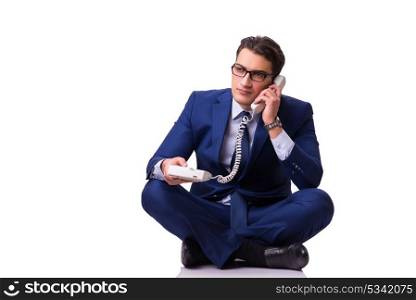 Businessman sitting on the floor isolated on white
