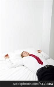 Businessman sleeping in bed at home