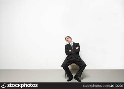 Businessman sleeping in chair
