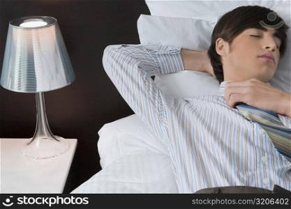 Businessman sleeping on the bed