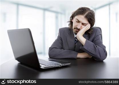 businessman sleeping on the laptop, at the office