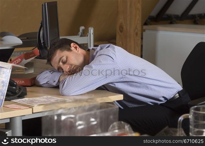 Businessman sleeping on the table