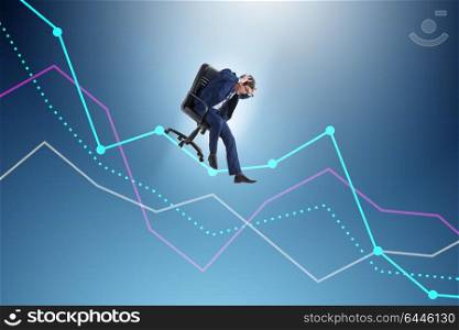 Businessman sliding down on chair in economic crisis concept