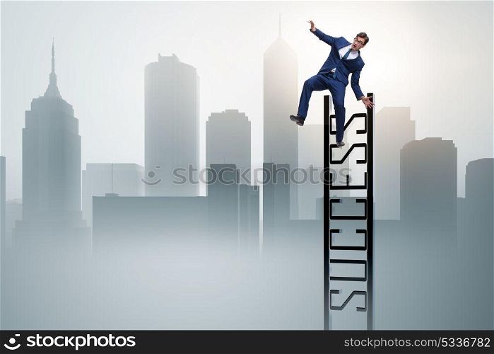 Businessman slipping from the top of ladder